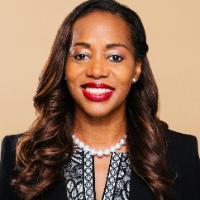 A person named Shannon Nash smiling in professional attire.