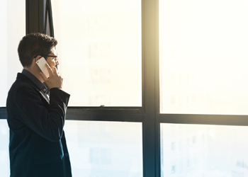 Man looking out window