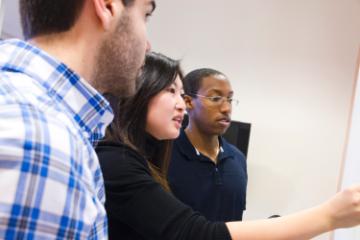 Graduate business students in Lucas Hall project room