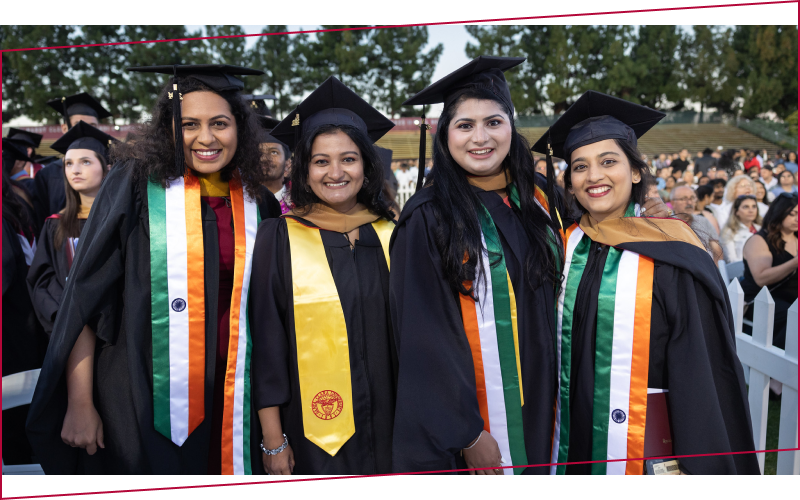 Leavey School of Business students in their commencement attire