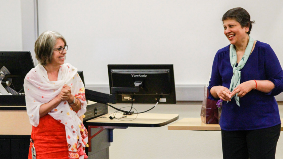 Purnima Kochikar and Sunaina Gulati-Ruh in front of a classroom