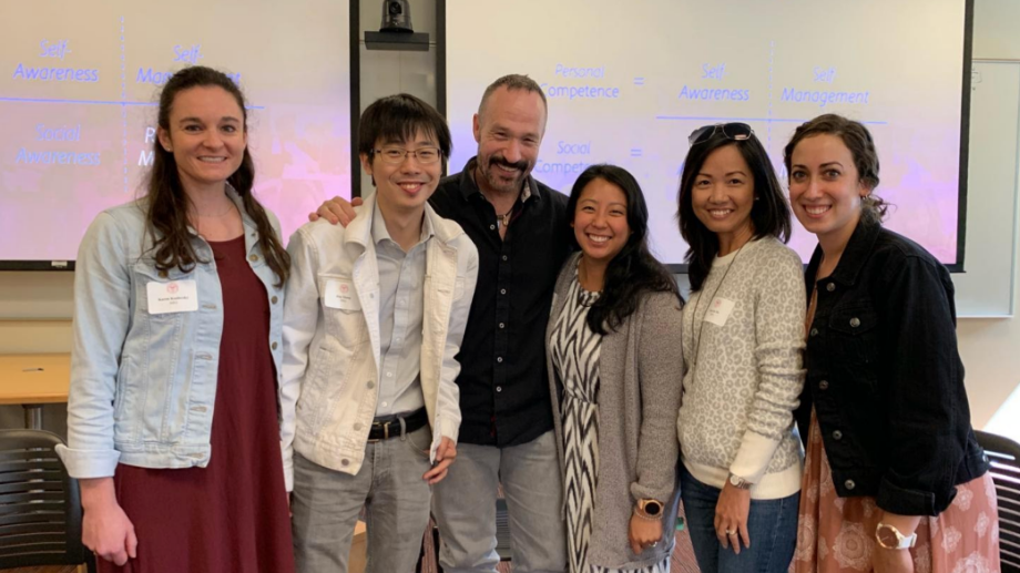 Weston McMillan takes a photo with 5 students