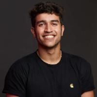 A person smiling, titled 