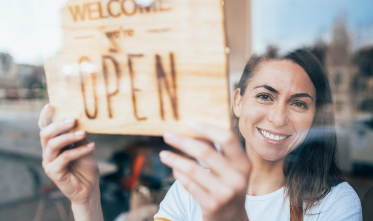 Photo of woman in a shop in front of an 