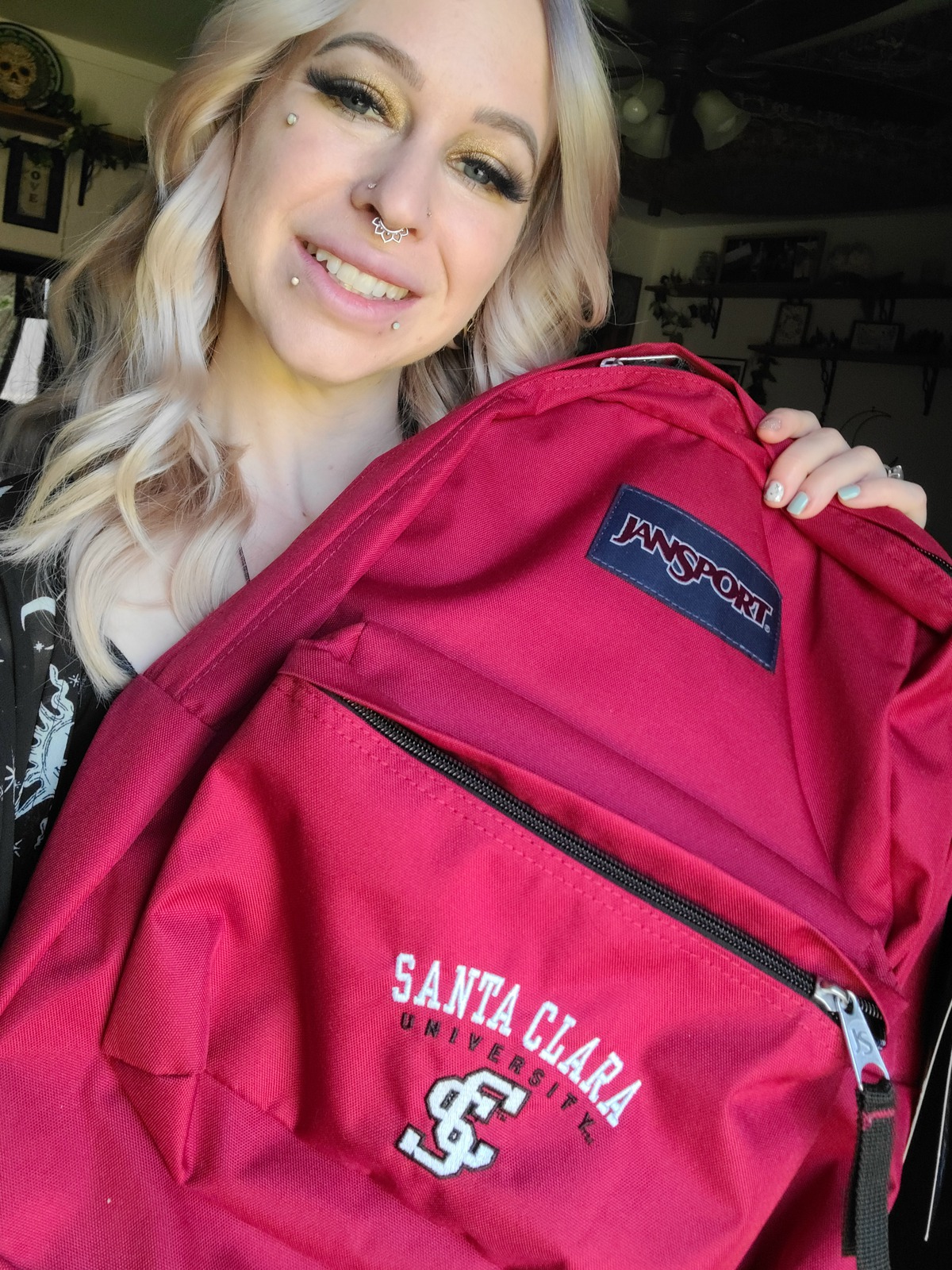 Photo of MOBI student with SCU Backpack