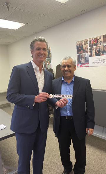 Governor Newsom and Jesus Martinez hold MOBI sticker