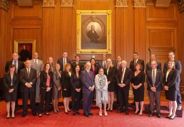 Photo of Board Member Laura Norris with U.S. Supreme Court