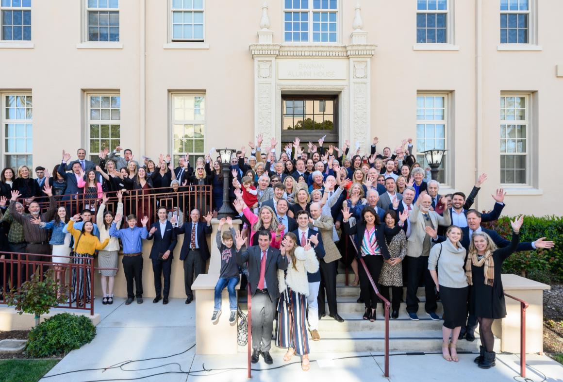 A huge group of people cheering in front of the newly rechristened Bannan Alumni House at Santa Clara University. A huge group of people cheering in front of the newly rechristened Bannan Alumni House at Santa Clara University.