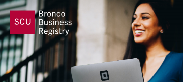 Woman holding computer with Bronco Business Registry Logo 