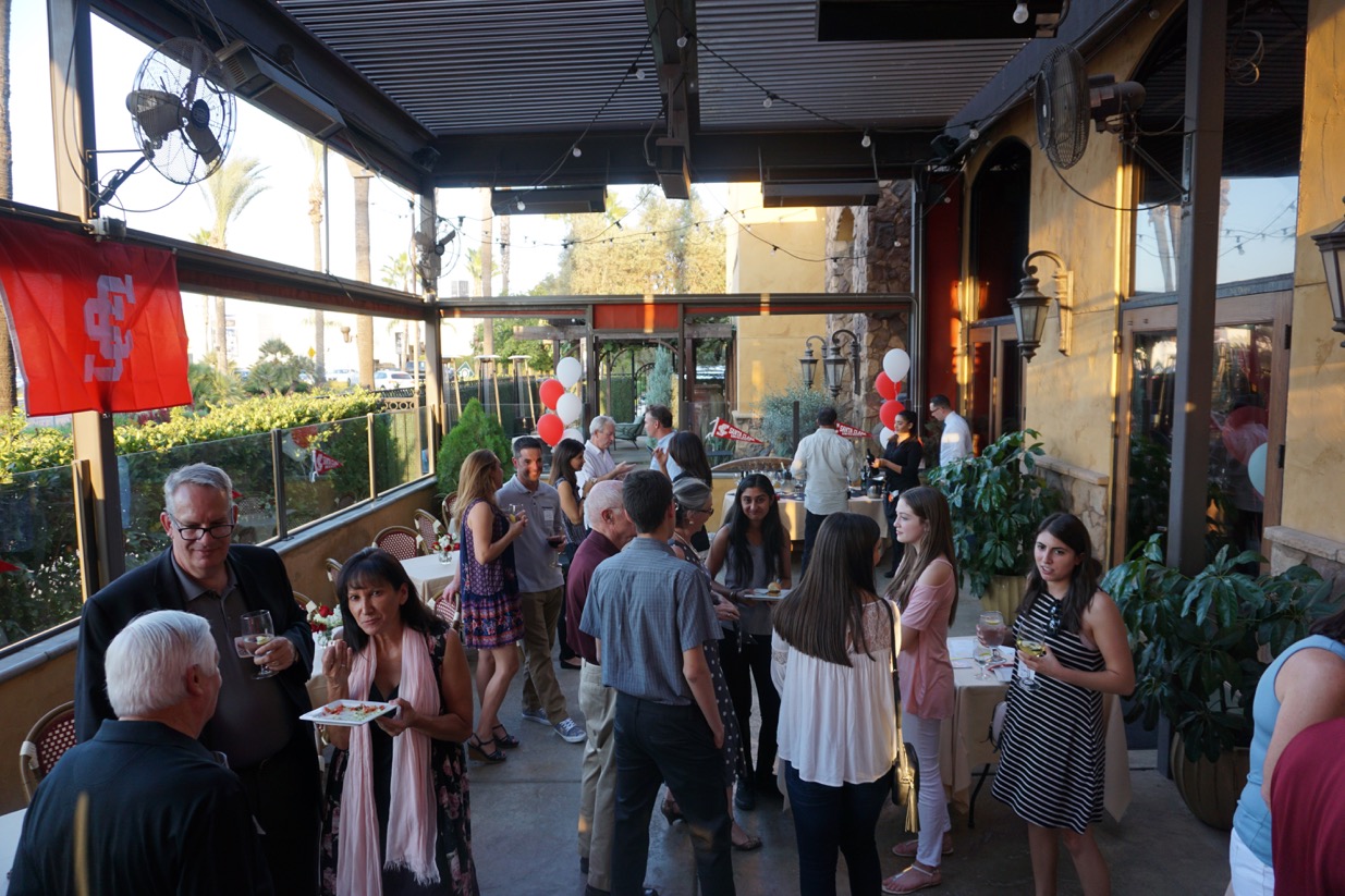 A lively gathering of people at an outdoor event.