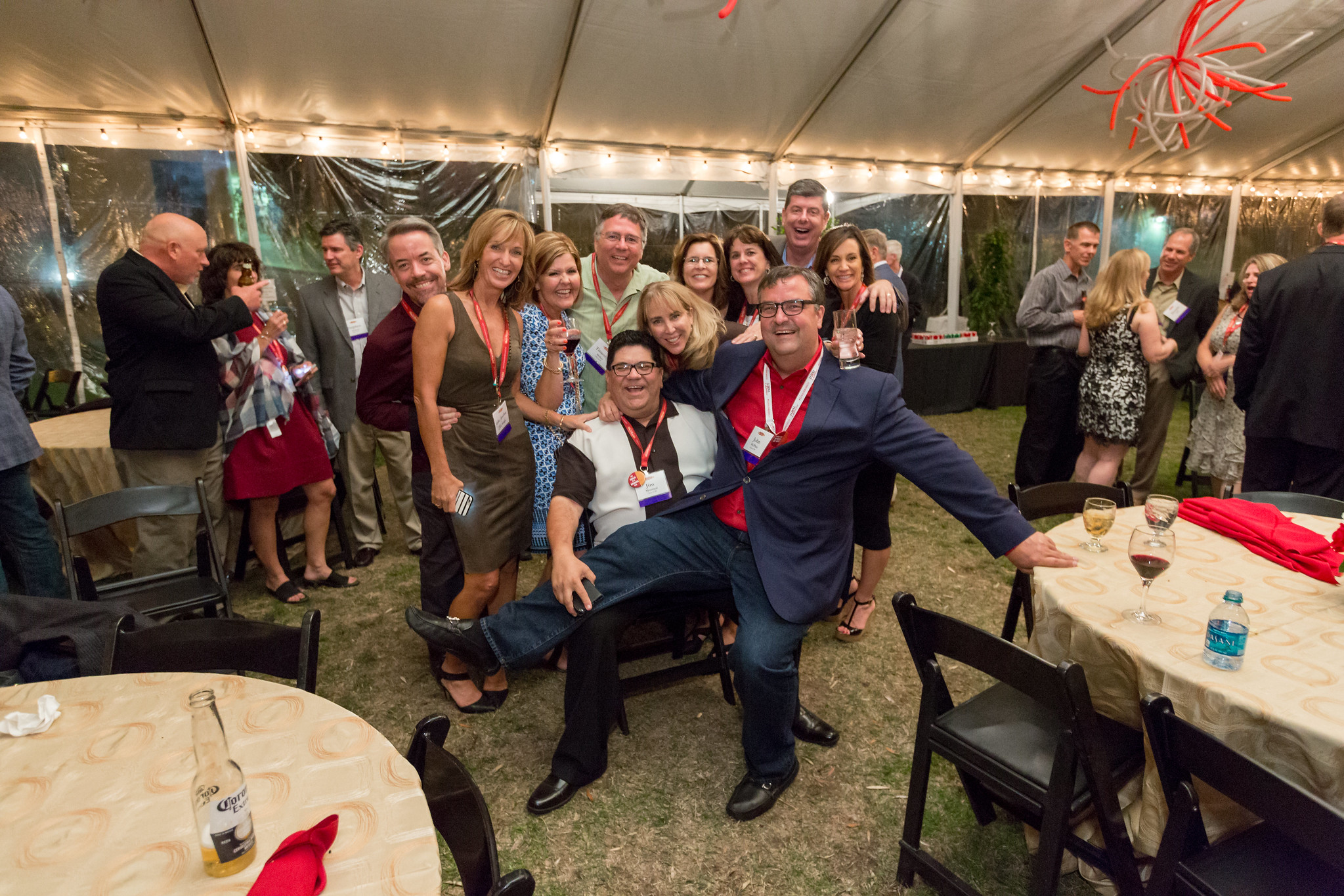 1985 Group of Alumni. Man being carried by a classmate 