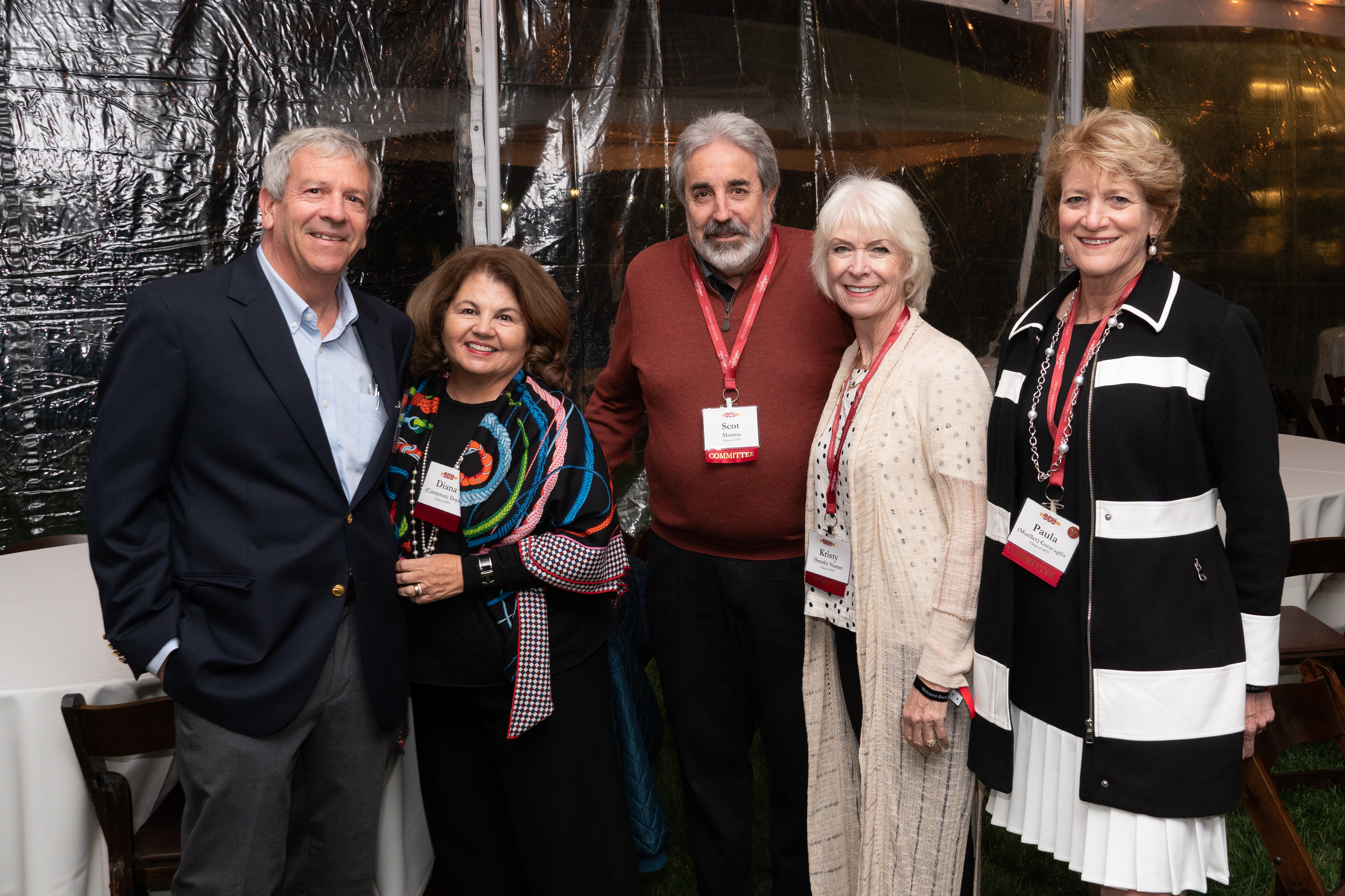 1975 SCU Alumni from the Grand Reunion committee standing at a class party 