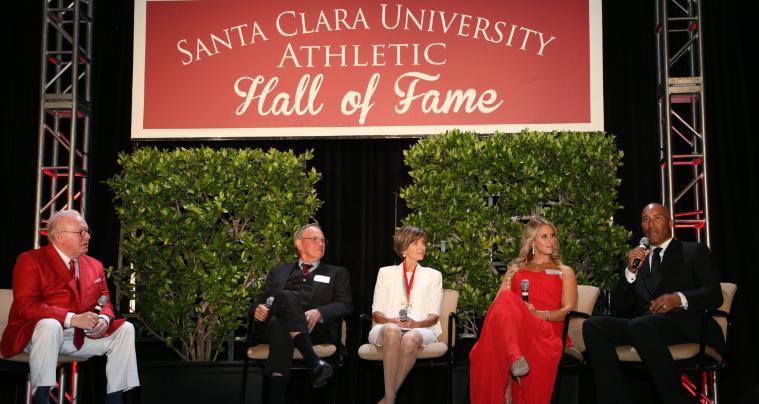Five people in chairs onstage under 'Shoal Creek Conservancy Founders' Hall of Fame' sign.