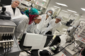 Professor teaching students in lab 