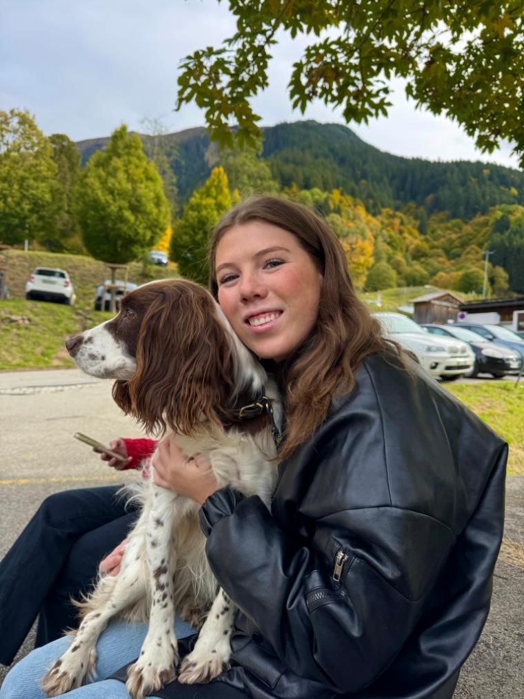 Decorative; student posting with a dog