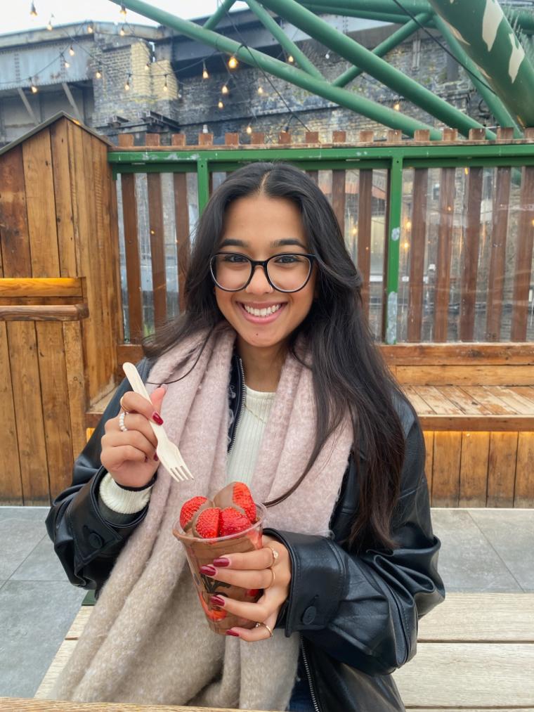 Decorative; student smiling and eating a snack