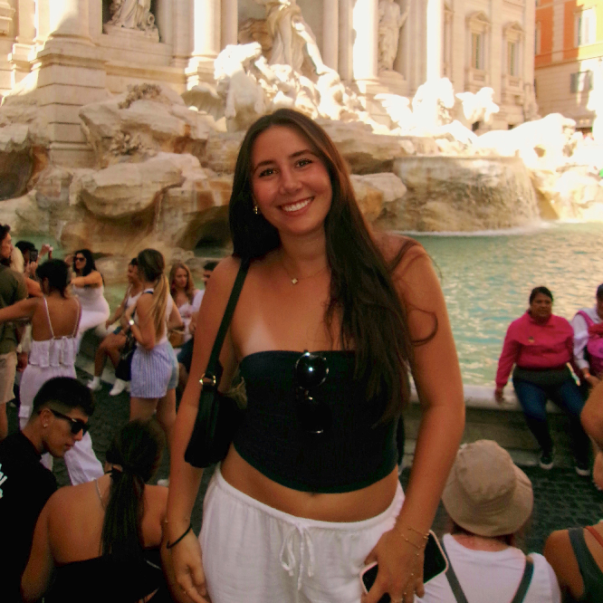 Decorative; student posing in front of a fountain in Italy