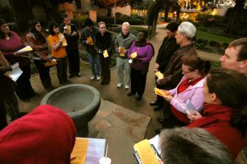 Jesuit with students linking to campus ministry