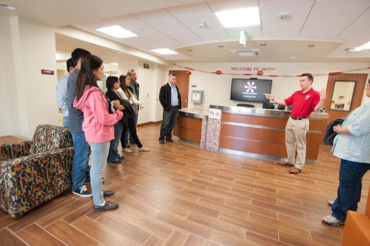 The print stations are located at the service desks. 