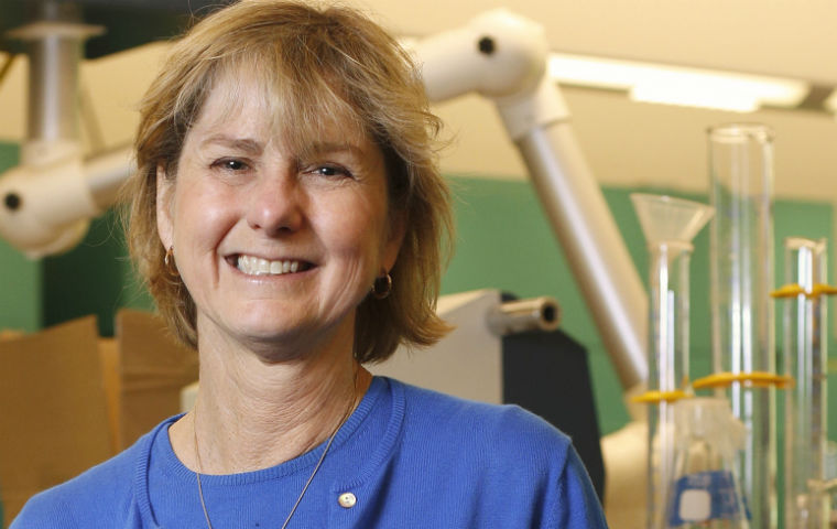 Woman smiling in a dental office.