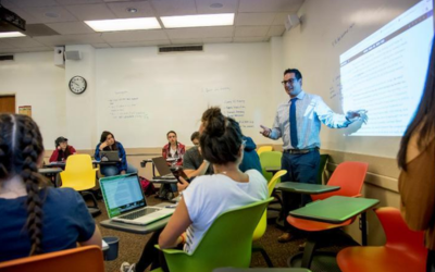 SCU professor reviewing syllabus for students 