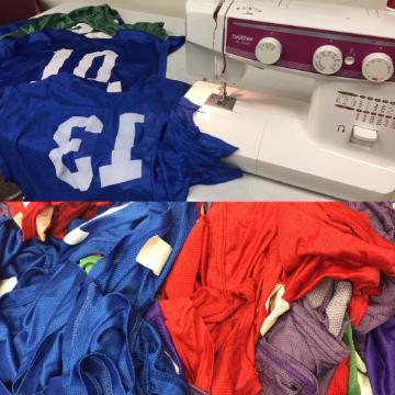 Pennies being sewn near a sewing machine.