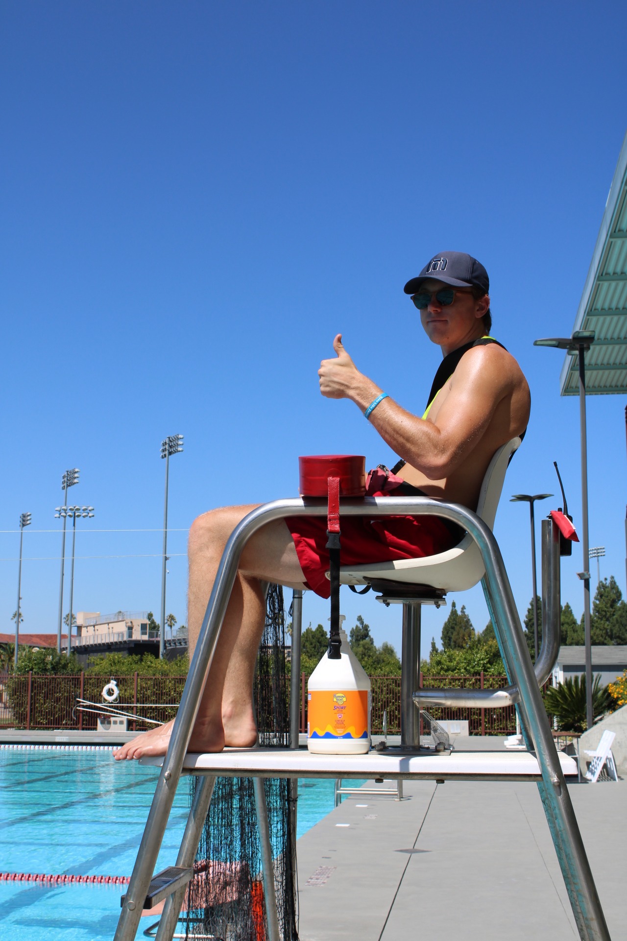 Lifeguard sitting at pool