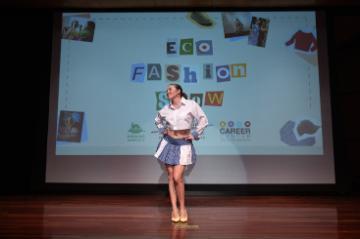 Student modeling on the stage for eco fashion show