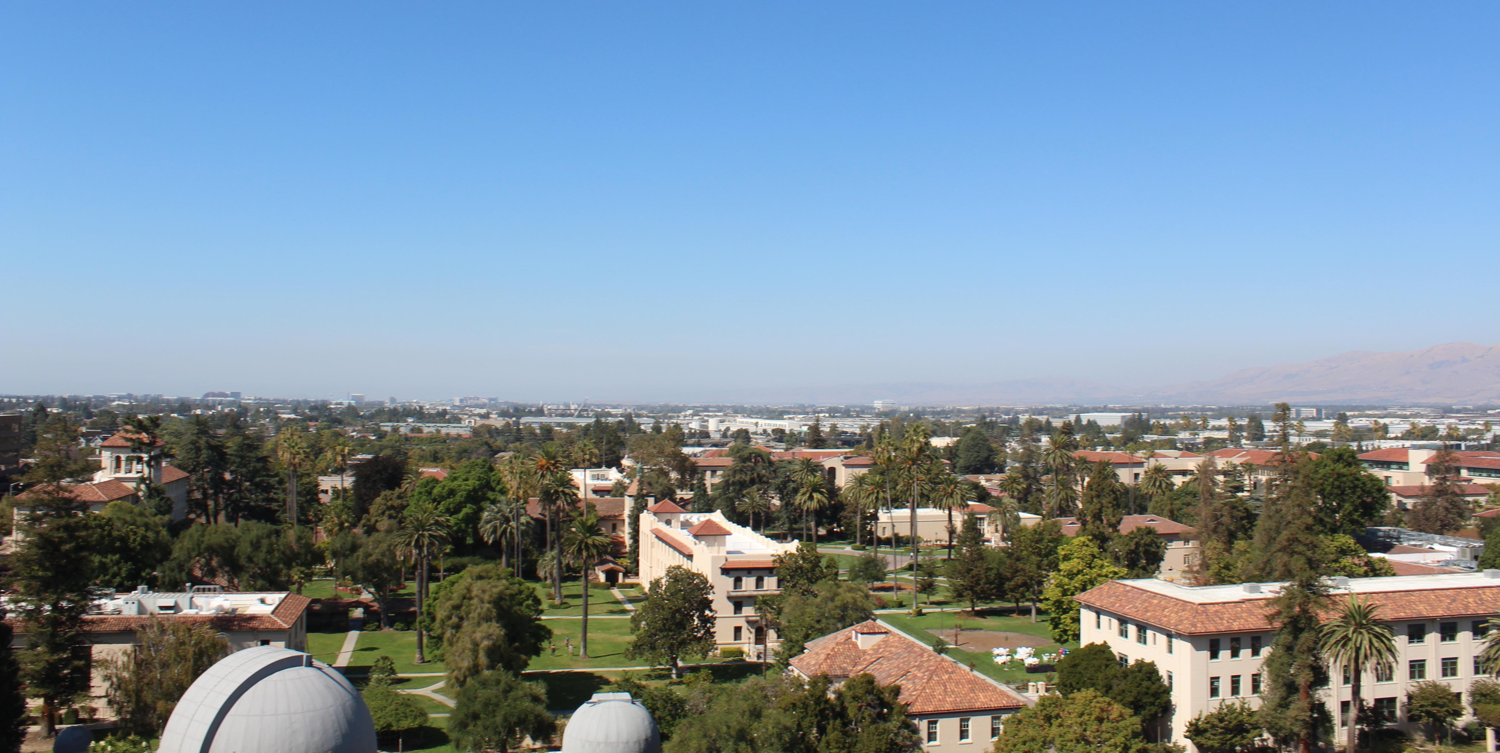 An overhead view of Santa Clara University's campus with the city of Santa Clara in the distance. image link to story