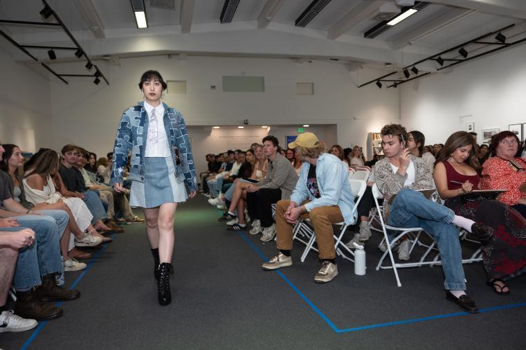 Student in denim at the eco fashion show on the runway