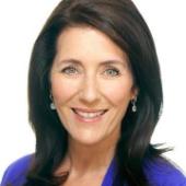 A woman smiling in a professional headshot.