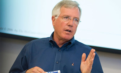 A person gesturing while speaking. image link to story