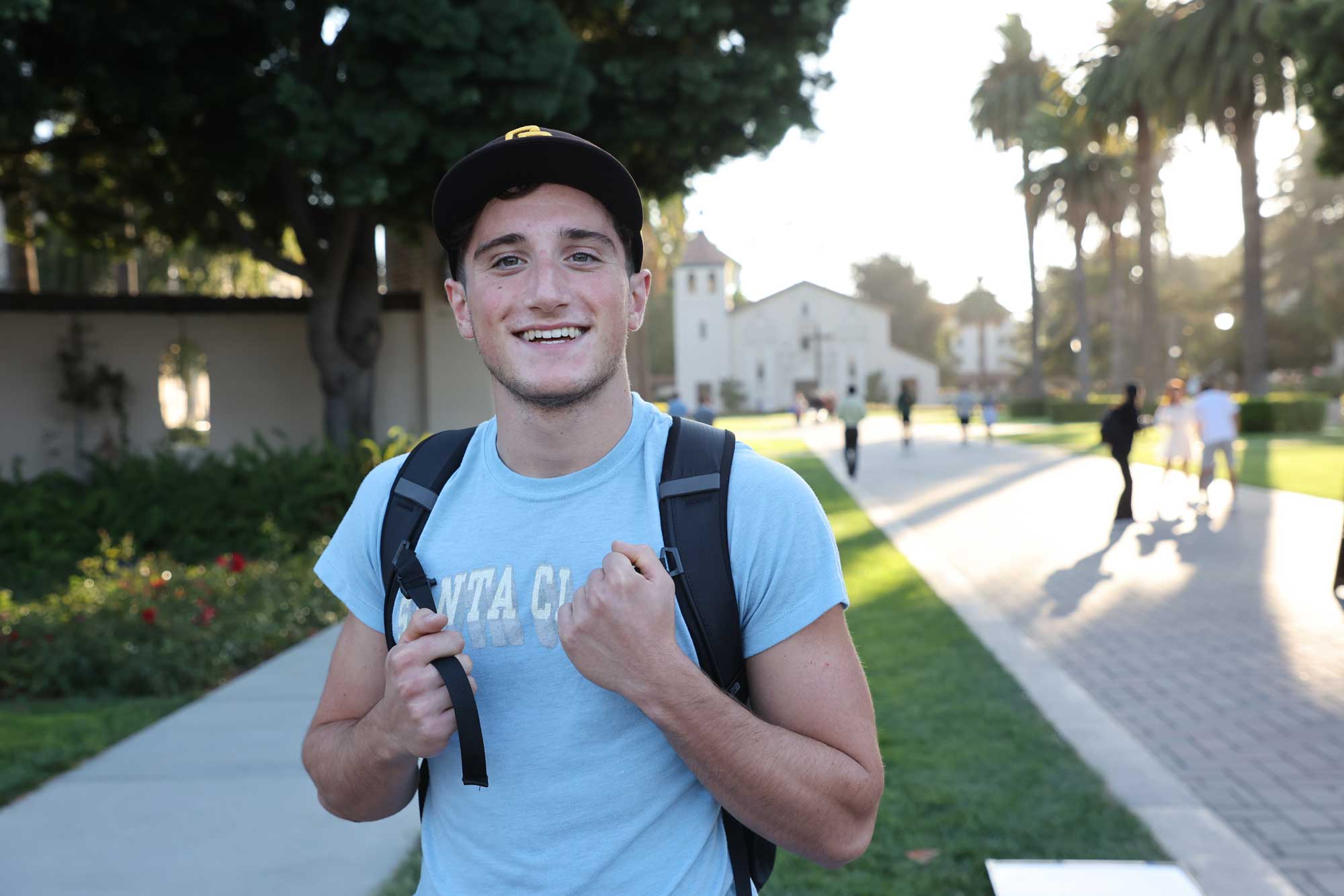 Student standing in front of the Mission