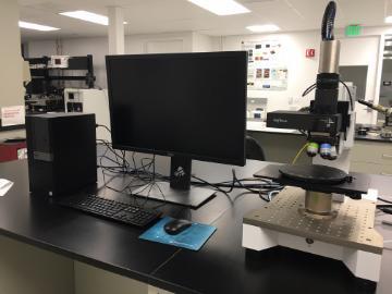 A Zeta-20 Optical Profiler setup with a monitor on a lab bench.