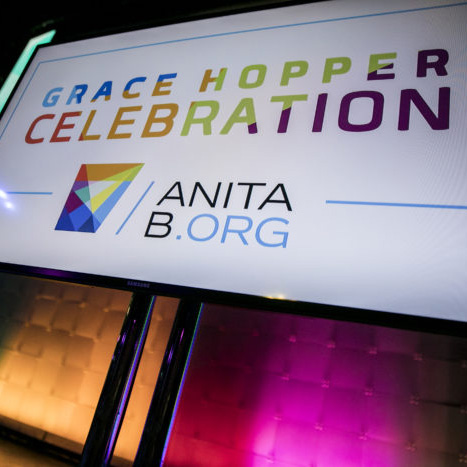 Grace Hopper Celebration logo displayed with colorful lights