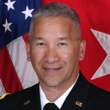 Major General Stephen Hager in military uniform with flag background.