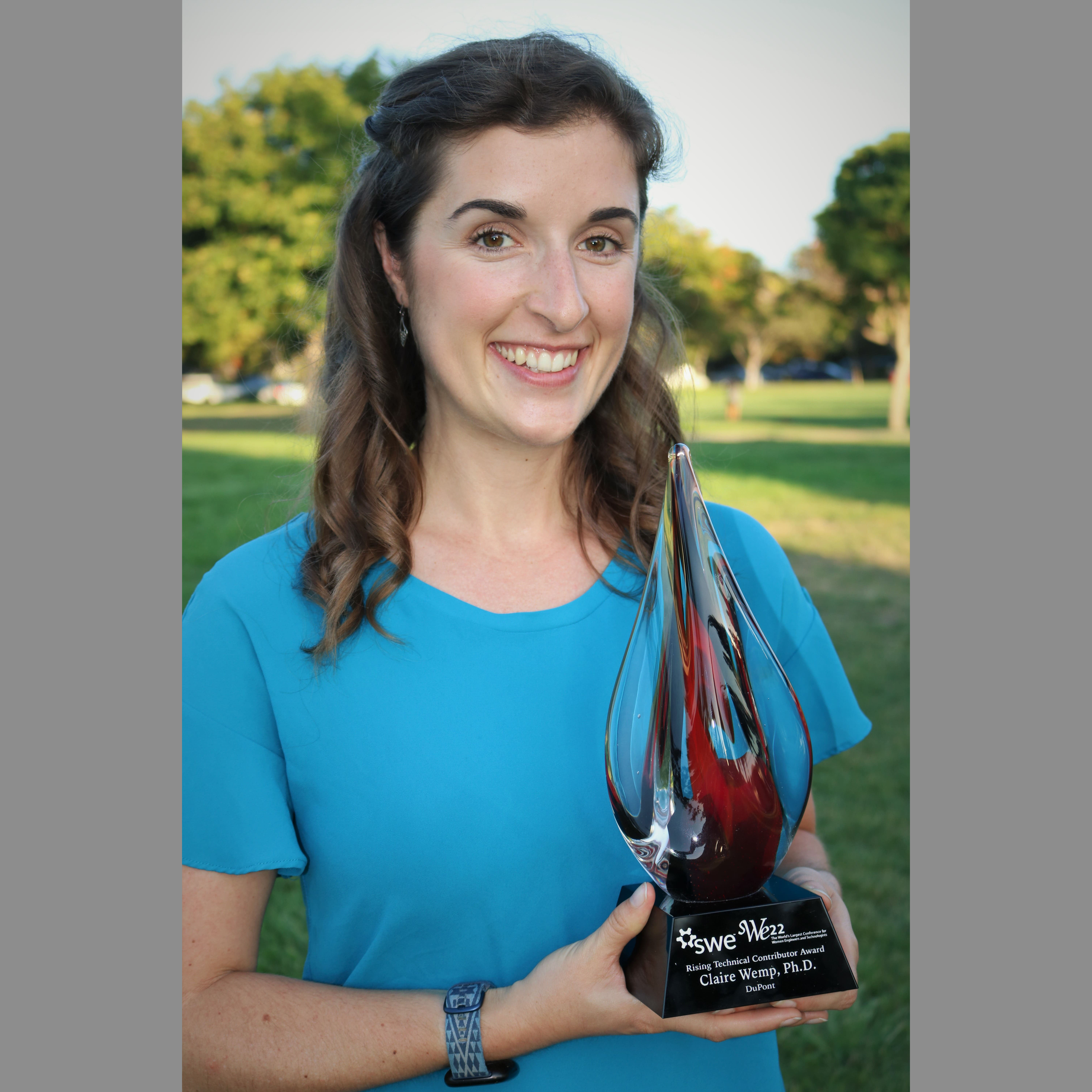 Claire Wemp holding SWE22 Award. SQ2