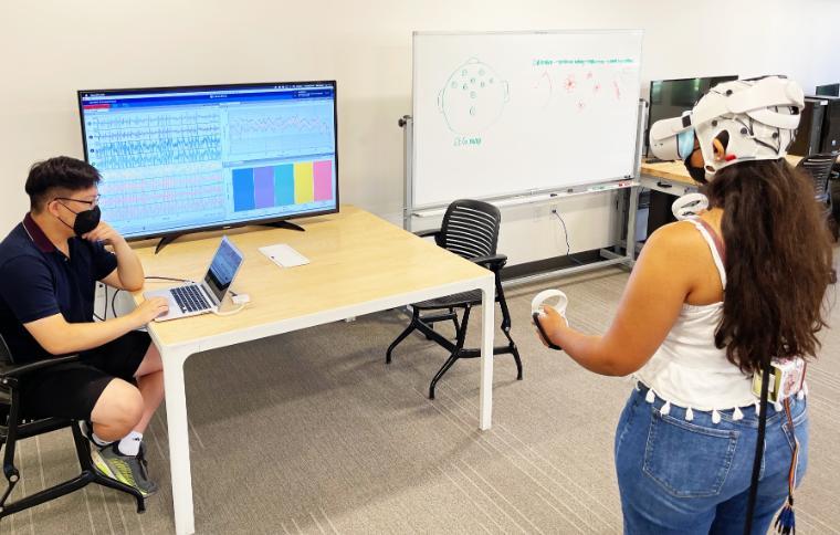 Two students use virtual reality in the BioInnovations and Design Lab