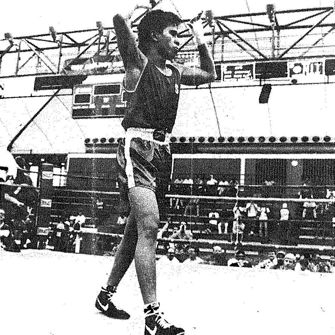 1990 national collegiate boxing champion Vince Llorin '92 takes a victory lab. Photo by Tim Currier. image link to story