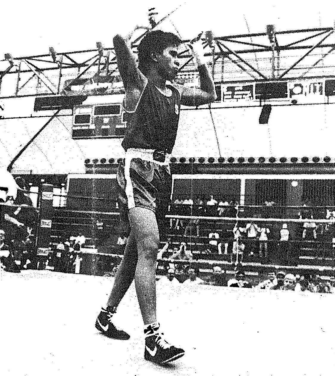 1990 national collegiate boxing champion Vince Llorin '92 takes a victory lap. Photo by Tim Currier. image link to story