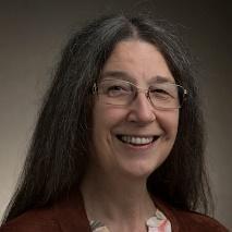 Person with glasses smiling, titled 'Ruth Davis'.