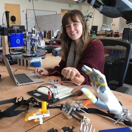 mechanical engineer working on a prosthetic arm