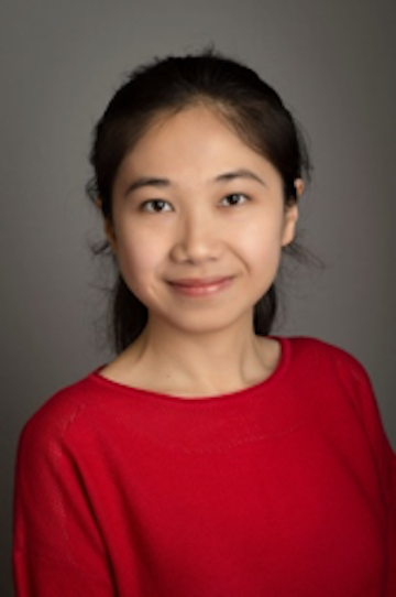 A person in a red shirt with a grey background.