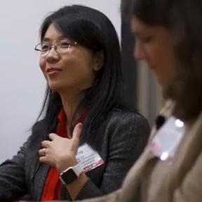 Yuhong Liu speaks as fellow panelist Irina Raicu looks on