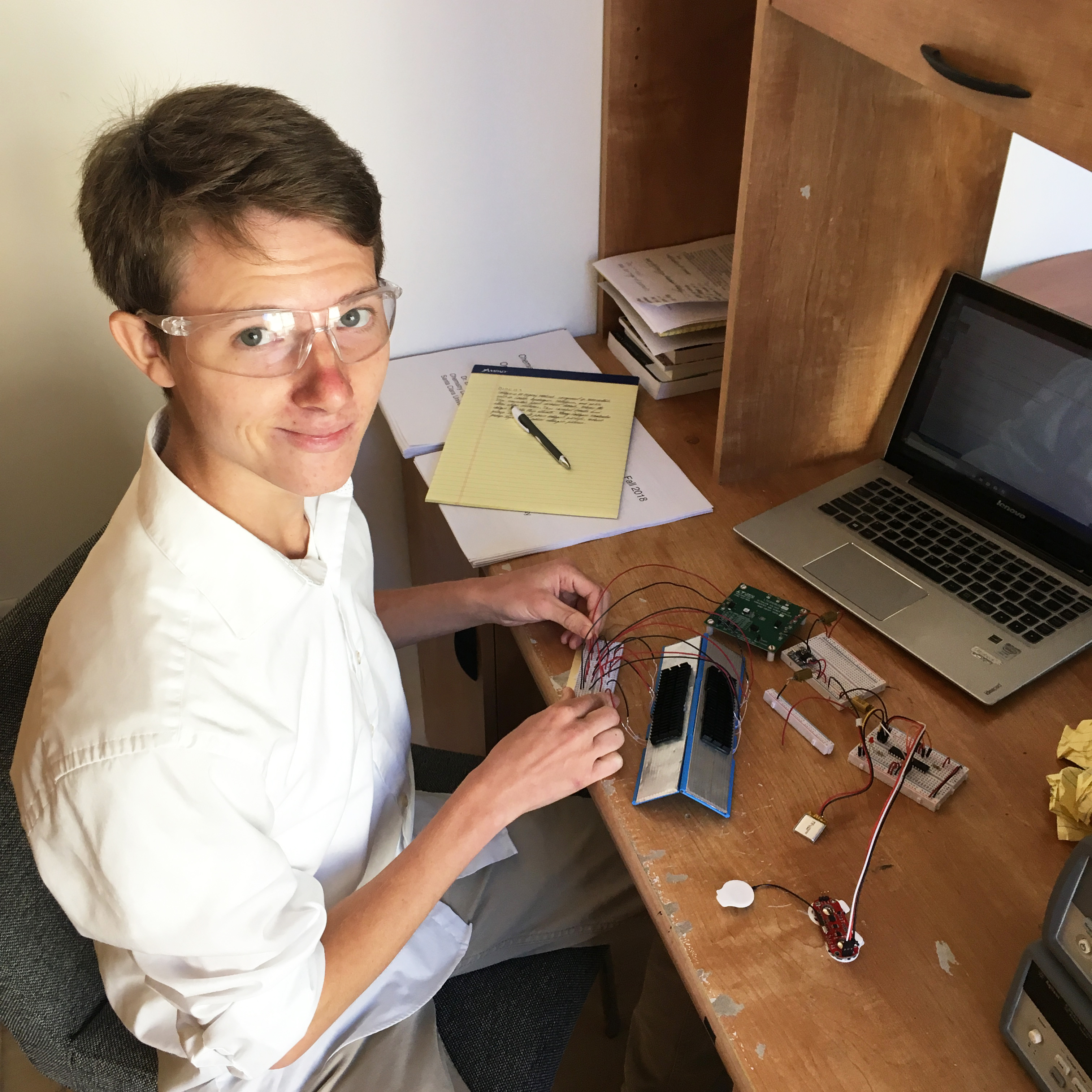Person working at a desk with a laptop. image link to story