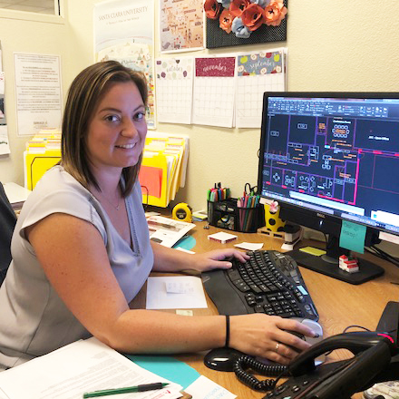 A person sitting at a desk with a computer. image link to story
