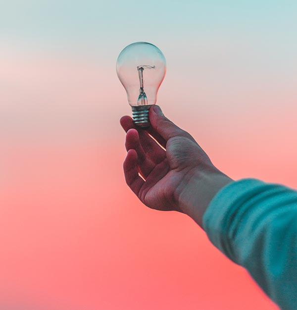 man holding lightbulb