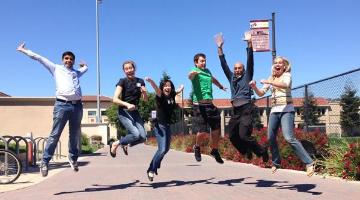 Students jumping in the air and enjoying 