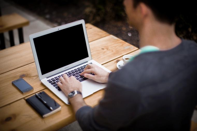 A student with a laptop in library 
